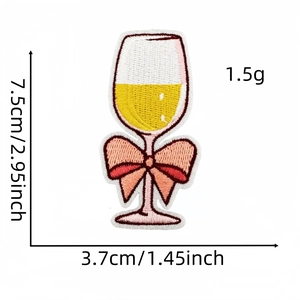 Detailed view of champagne glass embroidery patch with pink bow and dimensions