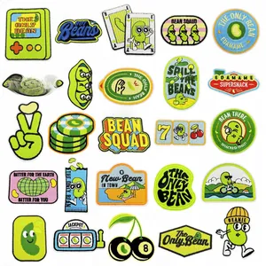 Close-up of 25 cute green edamame embroidery patches with high density stitching detail