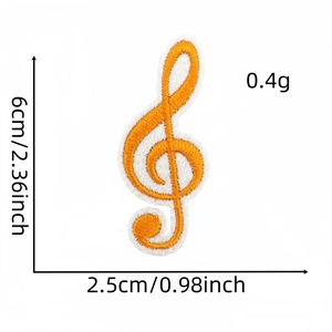 Detail view of orange treble clef music patch showing 6cm height and 2.5cm width dimensions