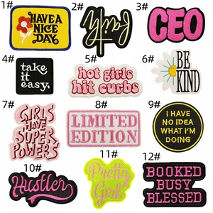 Detailed set of 12 colorful embroidered letter patches and flower motifs for clothing