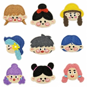 Set of 9 cute cartoon girl embroidered iron-on patches with various colorful hairstyles