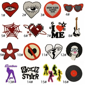 Detailed grid view of 16 Y2K style embroidered iron-on patches with rock star themes