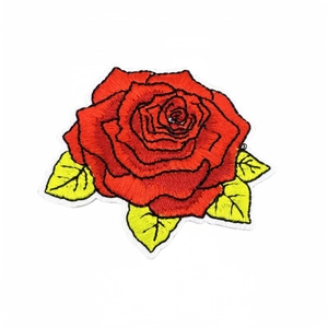 Vibrant red rose flower embroidery patch with green leaves on white background