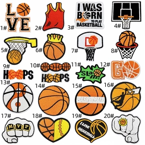 Detailed close-up of 20 assorted basketball themed embroidery patches with vivid textures