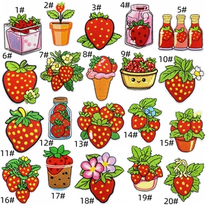 Close-up of 20 strawberry embroidery patches showing detailed stitching and vibrant colors