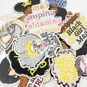 Detailed high-density embroidery patches featuring Black Girl Magic and empowering slogans