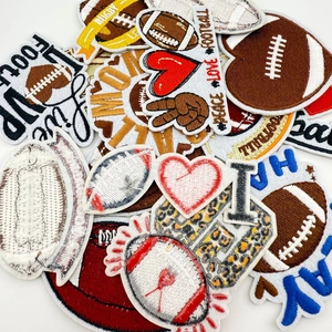 Macro shot of embroidered football patches with detailed stitching and vibrant sports motifs