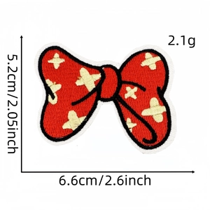 Red embroidered bow patch with yellow stars and precise white edge stitching for DIY