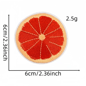 Vibrant 6cm orange slice embroidered patch for clothing with detailed needlework texture