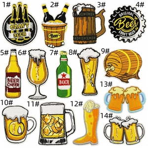 Detailed close-up of 14 cartoon beer-themed embroidery patches with dense stitching details