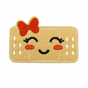 Cute band-aid shaped embroidery patch with a smiling face and red bow for clothing