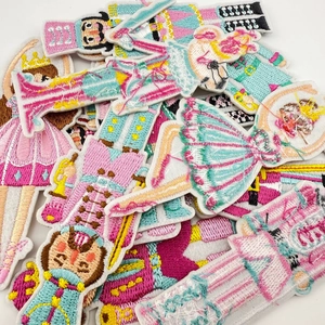 Detail showing colorful Nutcracker soldier and ballerina embroidered patches for garments