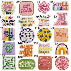 Detailed grid of 20 colorful embroidered motivational patches for garment decoration