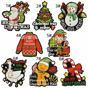 Detail of colorful Santa and Christmas tree embroidered iron-on patches for clothes