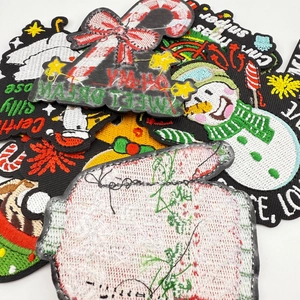 Detailed macro view of festive Christmas embroidery patches with high-quality stitching