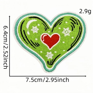 Green heart-shaped embroidered Christmas patch with white snowflakes and red heart design