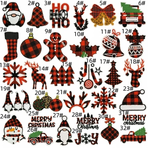 Macro view of Christmas embroidery patches featuring buffalo plaid patterns and festive icons
