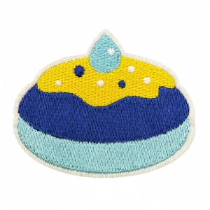 Embroidered Hanukkah patch with yellow and blue stitching on white background