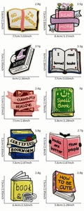 Detail view of cartoon book embroidery patches with dimensions and weight specs