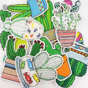 Detailed view of assorted green cactus and succulent embroidered iron-on patches
