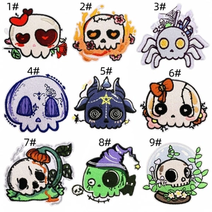 Detailed grid of nine Halloween skull embroidery patches with roses and hearts