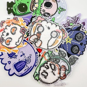 Detail shot of Halloween cartoon skeleton embroidery patches with high-density stitched edges