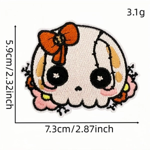 Embroidered cartoon skull patch with orange bow and floral details, size 7.3cm x 5.9cm