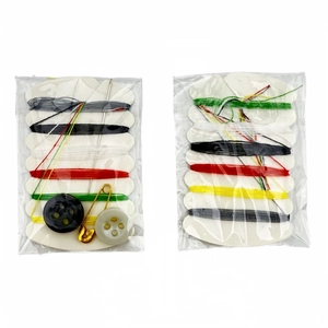 Detail view of portable sewing kit including multi-color threads, needles, and buttons