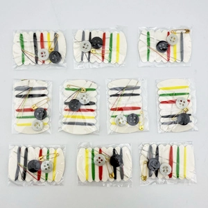 Macro view of 10 pack portable sewing kits including multi-color threads and tools