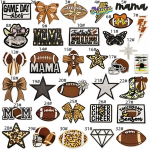 Detail view of 32 leopard print rugby patches and mini sewing kit on white background