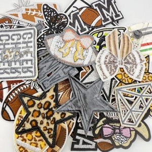 Detailed embroidery patches set featuring leopard stars and rugby theme motifs