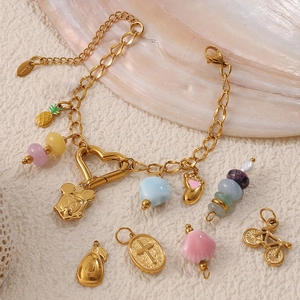 Golden stainless steel charm bracelet with enamel pineapple and Mickey-style charms
