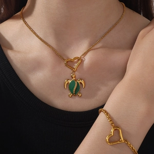 18k gold plated necklace and bracelet set with green enamel turtle and heart clasp charms