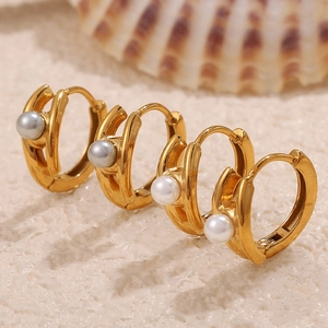 Elegant 18k gold plated stainless steel pearl hoop earrings on a sandy beach setting