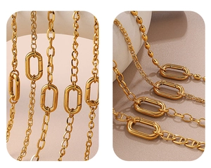 Detailed close-up of golden stainless steel chain link with spring clasp mechanism