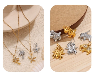 Detailed macro view of gold and silver palm tree and starfish pendants with rhinestones