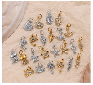 Detailed view of marine charms with rhinestones including starfish and palm tree pendants