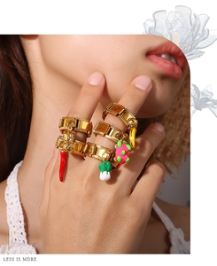 Detail of 18K gold-plated modular ring with chili, peanut and fruit charms for women