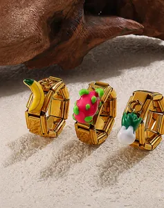 Detail view of 18K gold plated stretch rings with enamel fruit and vegetable charms