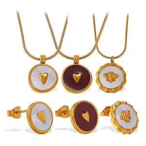 Golden heart and bee jewelry sets with white shell or red enamel inlays on snake chains