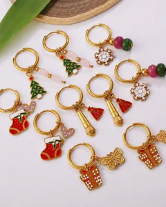 Detailed view of 18K gold plated Christmas earrings with festive charms and colorful beads