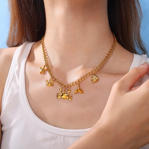 18k gold plated stainless steel ocean necklace with starfish and crab charms on a model