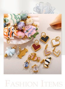 Detail of DIY fish and heart charms with 18K gold plating and colorful enamel work