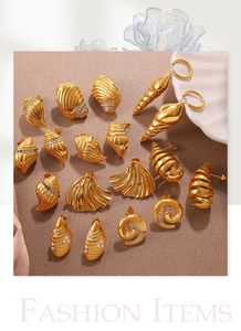 Detail of 18K gold-plated ocean-themed earrings featuring shells, conches, and pearls
