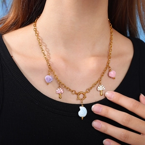 18K gold plated stainless steel necklace featuring colorful ceramic fish and shell pendants