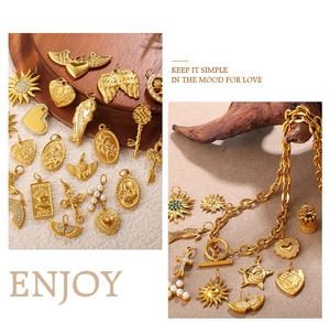 Macro detail of vintage 18K gold plated heart and key charms on a wooden texture background