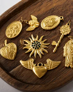 Vintage 18K gold plated charms featuring St. Jude, sun with green gem, and key motifs