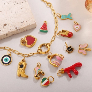 18K gold-plated paperclip bracelet with colorful enamel DIY charms on a stone background