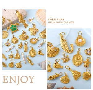 Collection of ocean-themed gold-plated charms featuring sea shells, fish and faux pearls