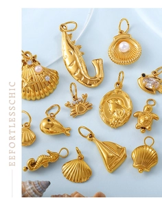 Collection of gold-plated ocean pendants featuring sea shells, seahorses and small fish